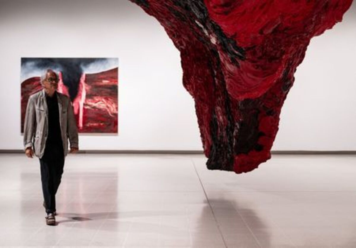 British-Indian sculptor Anish Kapoor poses for a photograph next to his installation 'Mount Moriah at the Gate of the Ghetto' (2022) during the press view for 'Anish Kapoor' at the Hayward Gallery, in London, Britain, June 15, 2026. REUTERS/Chris J. Ratcliffe