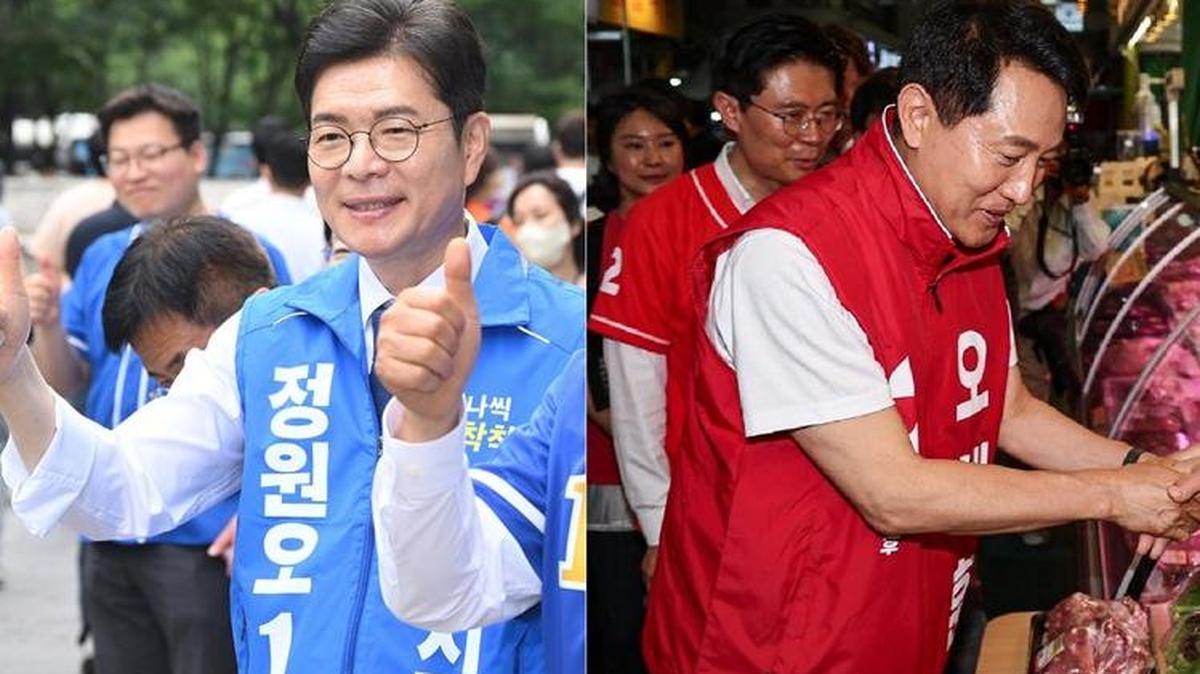 Democratic Party Seoul mayoral candidate Jung Won-oh campaigns outside Yeouido Station in Seoul’s Yeongdeungpo district on May 26, while People Power Party Seoul mayoral candidate Oh Se-hoon visits Mangwon Market in Seoul’s Mapo district the same day. Photo by Asia Today