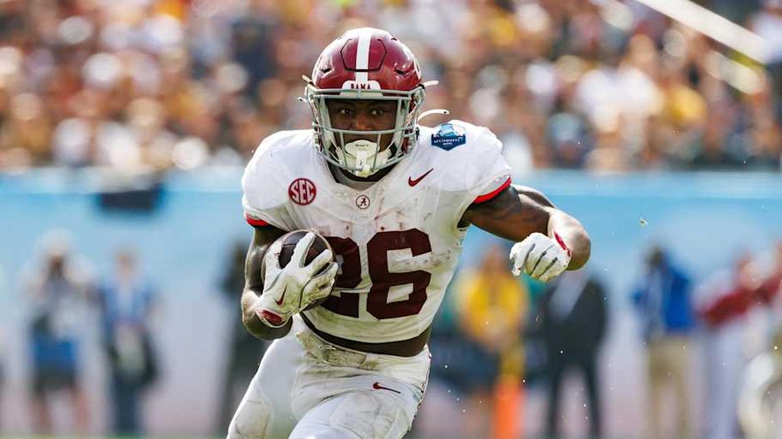  Dec 31, 2024; Tampa, FL, USA; Alabama Crimson Tide running back Jam Miller (26) rushes with the ball against the Michigan Wolverines during the first half at Raymond James Stadium. Mandatory Credit: Matt Pendleton-Imagn Images | Matt Pendleton-Imagn Images 