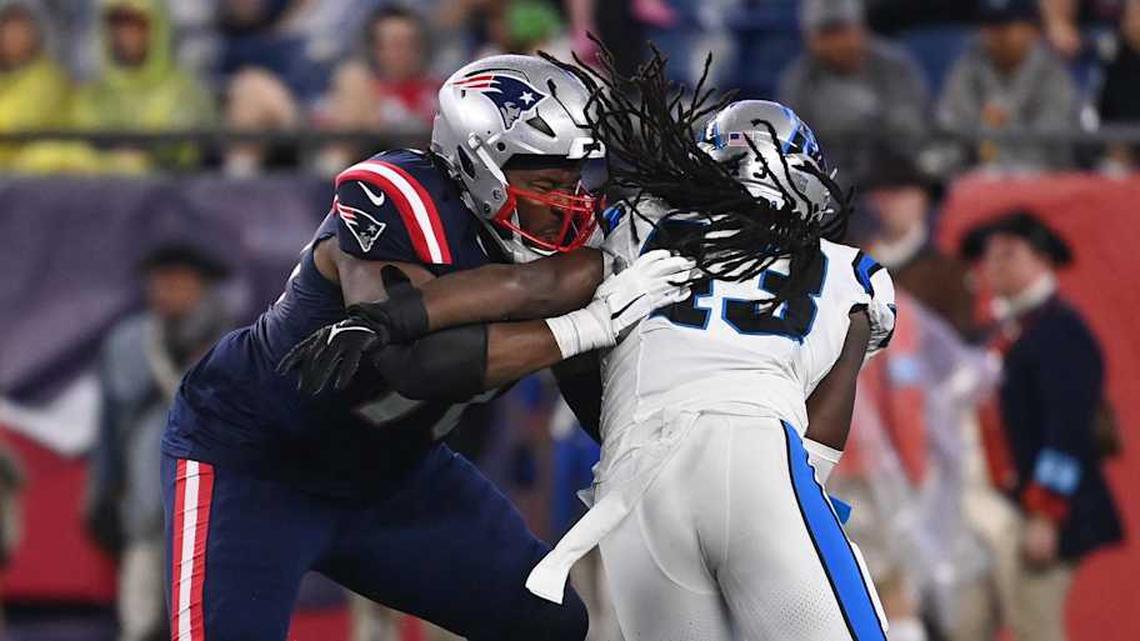  August 8, 2024; Foxborough, MA, USA; New England Patriots offensive tackle Caedan Wallace (70) blocking Carolina Panthers linebacker Luiji Vilain (43) during the first half at Gillette Stadium. Mandatory Credit: Eric Canha-Imagn Images | Eric Canha-Imagn Images 