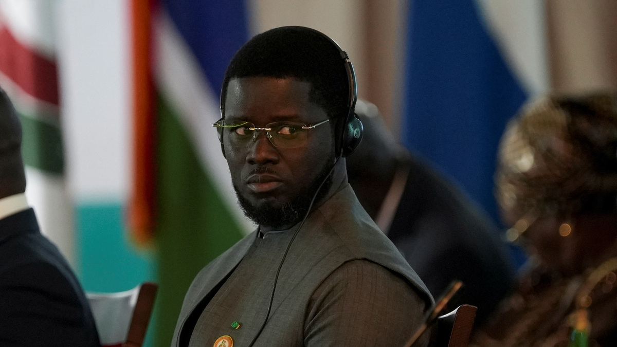 Senegal's President Bassirou Diomaye Diakhar Faye reacts during the Economic Community of West African States (ECOWAS) 67th Ordinary Session of the Authority of Heads of State and Government in Abuja, Nigeria, June 22, 2025. REUTERS/Marvellous Durowaiye