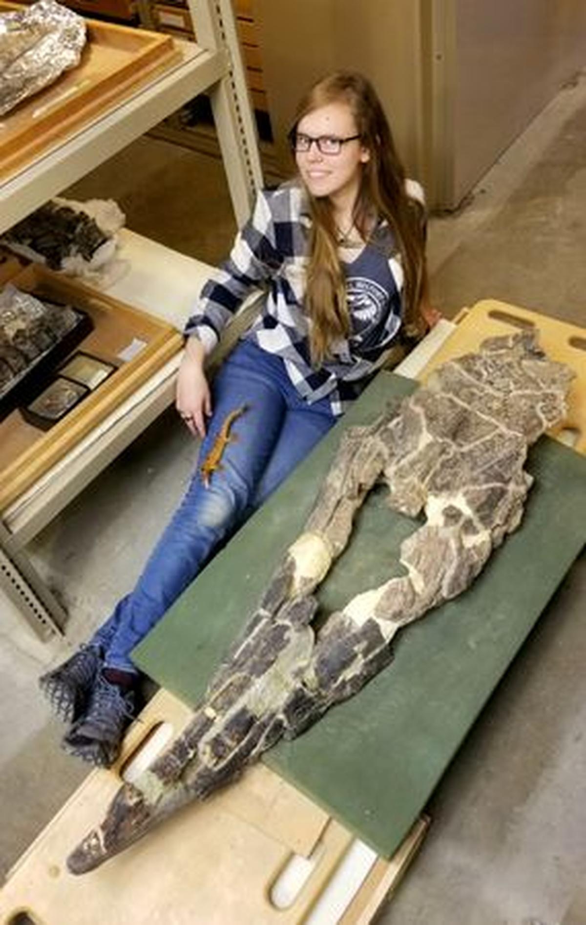 Researcher Amelia Zietlow with the skull of a Tylosaurus rex at the University of Kansas in Lawrence, Kansas, U.S., in an undated photograph. The image was released on May 21, 2026 Amelia Zietlow/Handout via REUTERS