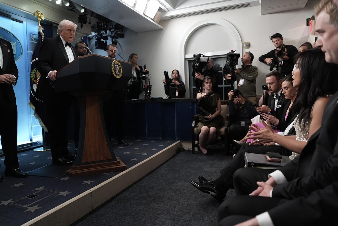Weija Wang of CBS News, the president of the White House Correspondents' Association, asks the first question as President Donald Trump briefs reporters at the White House after shots were fired during the association's annual dinner at the Washington Hilton on Saturday, April 25, 2026. Trump was rushed from the stage at the event but was unharmed. (Salwan Georges/The New York Times)