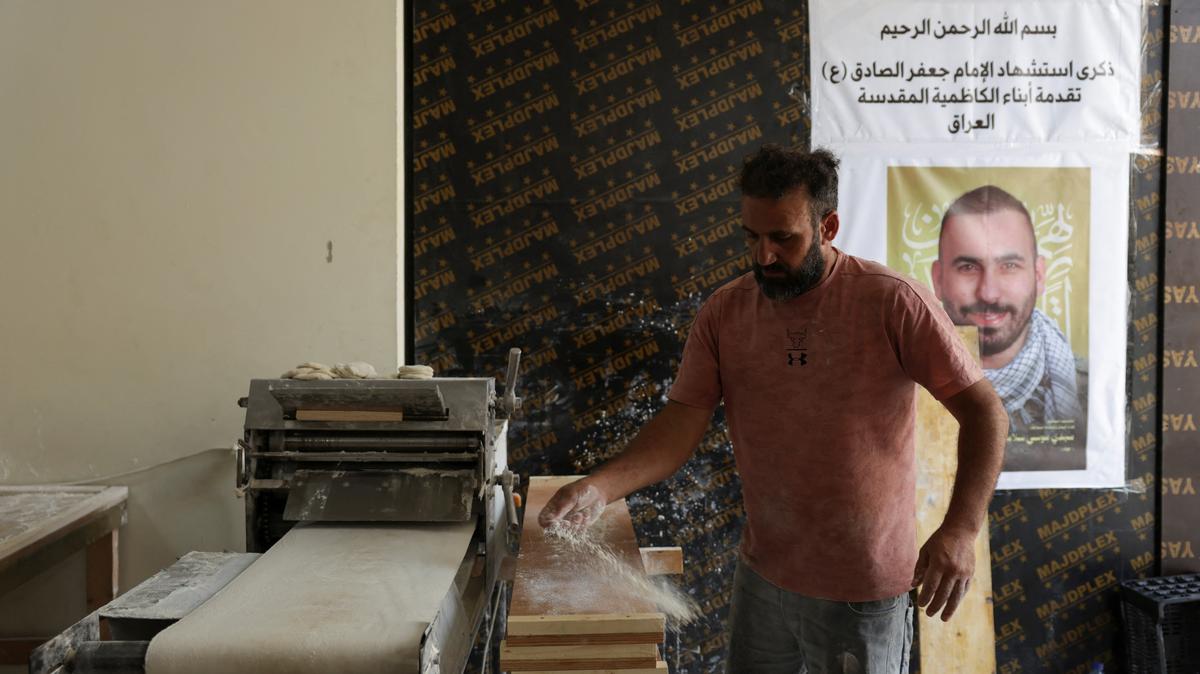 A man bakes at a school used as a temporary shelter for displaced people, in Beirut, Lebanon, May 2, 2026. REUTERS/ Raghed Waked