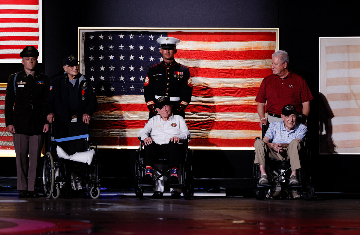 U.S. veterans join President Donald Trump on stage during a Fourth of July rally, marking the 250th anniversary of U.S. independence, on the National Mall in Washington, D.C., U.S., July 4, 2026. REUTERS/Evan Vucci