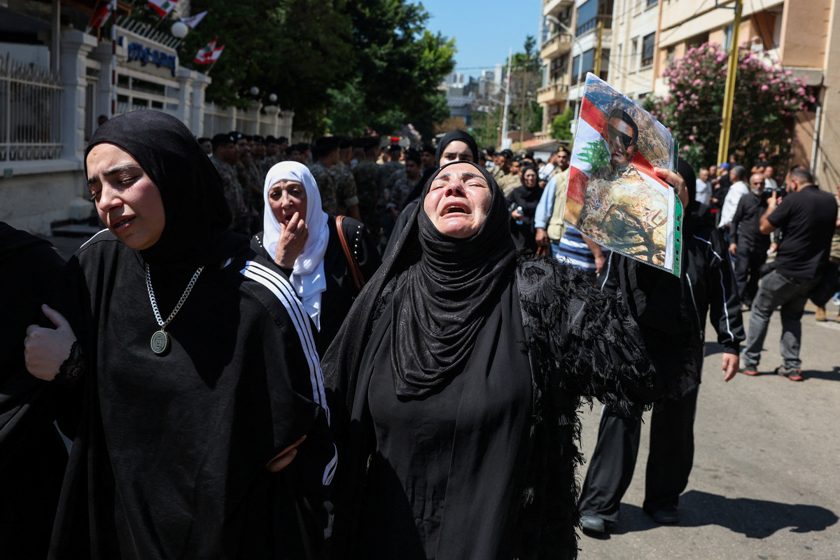 A mourner reacts during the funeral of Brigadier General Wissam Sabra, who was killed in an Israeli strike targeting their military vehicle on the Khardali-Nabatieh road in south Lebanon on Saturday, in Beirut, Lebanon June 7, 2026. REUTERS/Mohamed Azakir