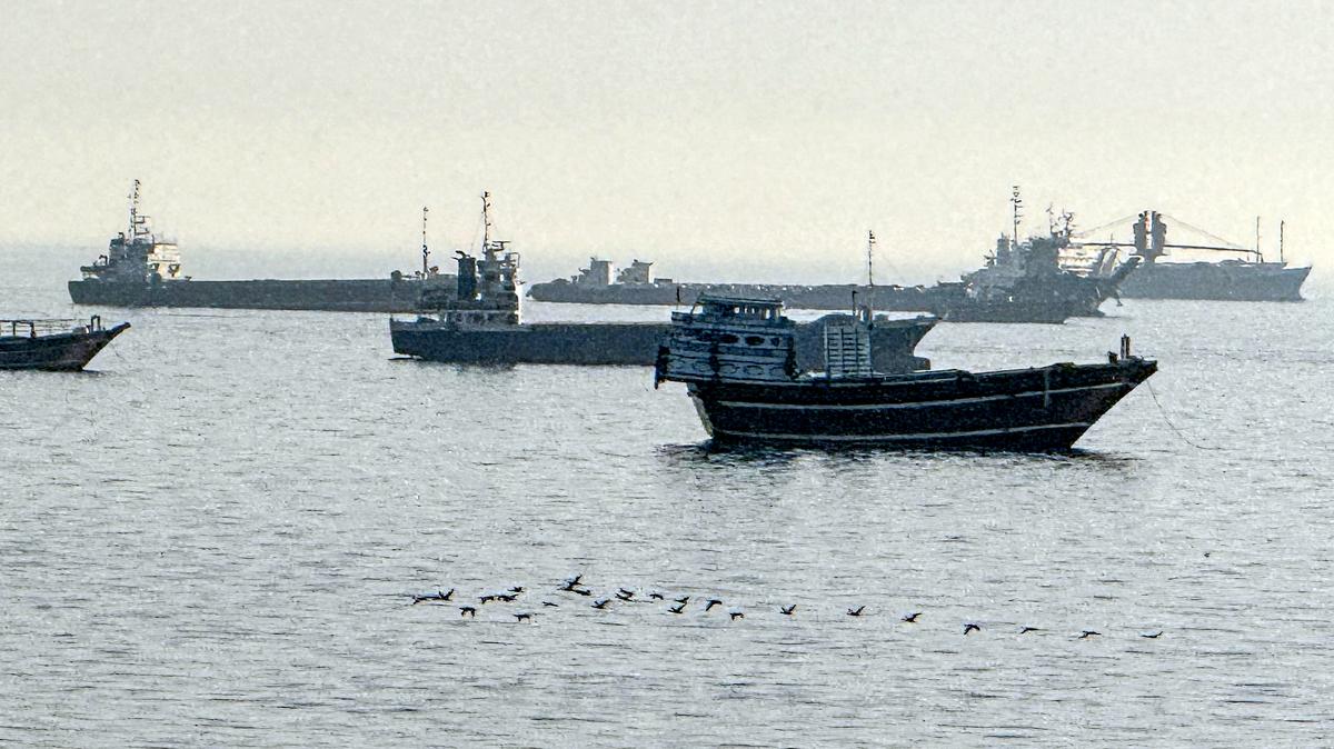 Vessels are seen anchored in the Strait of Hormuz, off the port city of Khasab on Oman's northern Musandam Peninsula on May 17, 2026. Washington, locked in conflict with Tehran since US and Israeli forces launched major strikes on the Islamic republic beginning February 28, has struggled to break an impasse and make any progress toward ending a war that has shaken the Middle East and sent energy prices climbing. The war has led to an effective blockade of the critical Strait of Hormuz, through which some 20 percent of global oil exports pass in peacetime, and has drawn neighbors Israel and Lebanon into a deadly side conflict. (AFP/Getty Images/TNS)