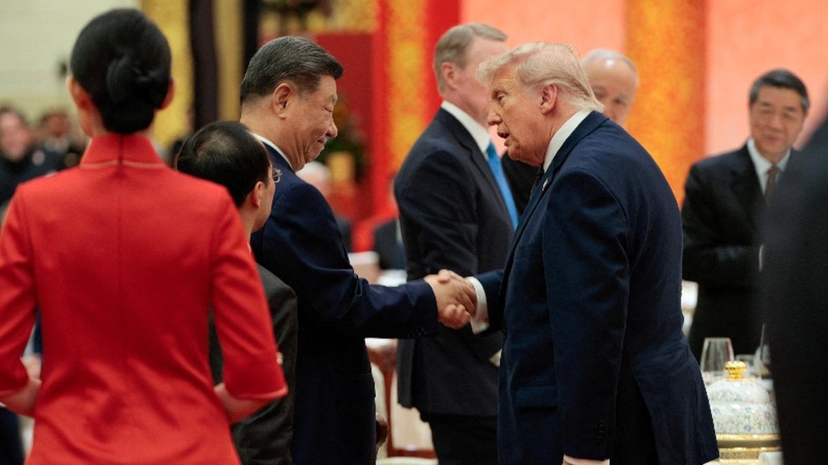Chinese President Xi Jinping and U.S. President Donald Trump shake hands at a state banquet at the Great Hall of the People in Beijing, China, May 14, 2026. REUTERS/Evan Vucci