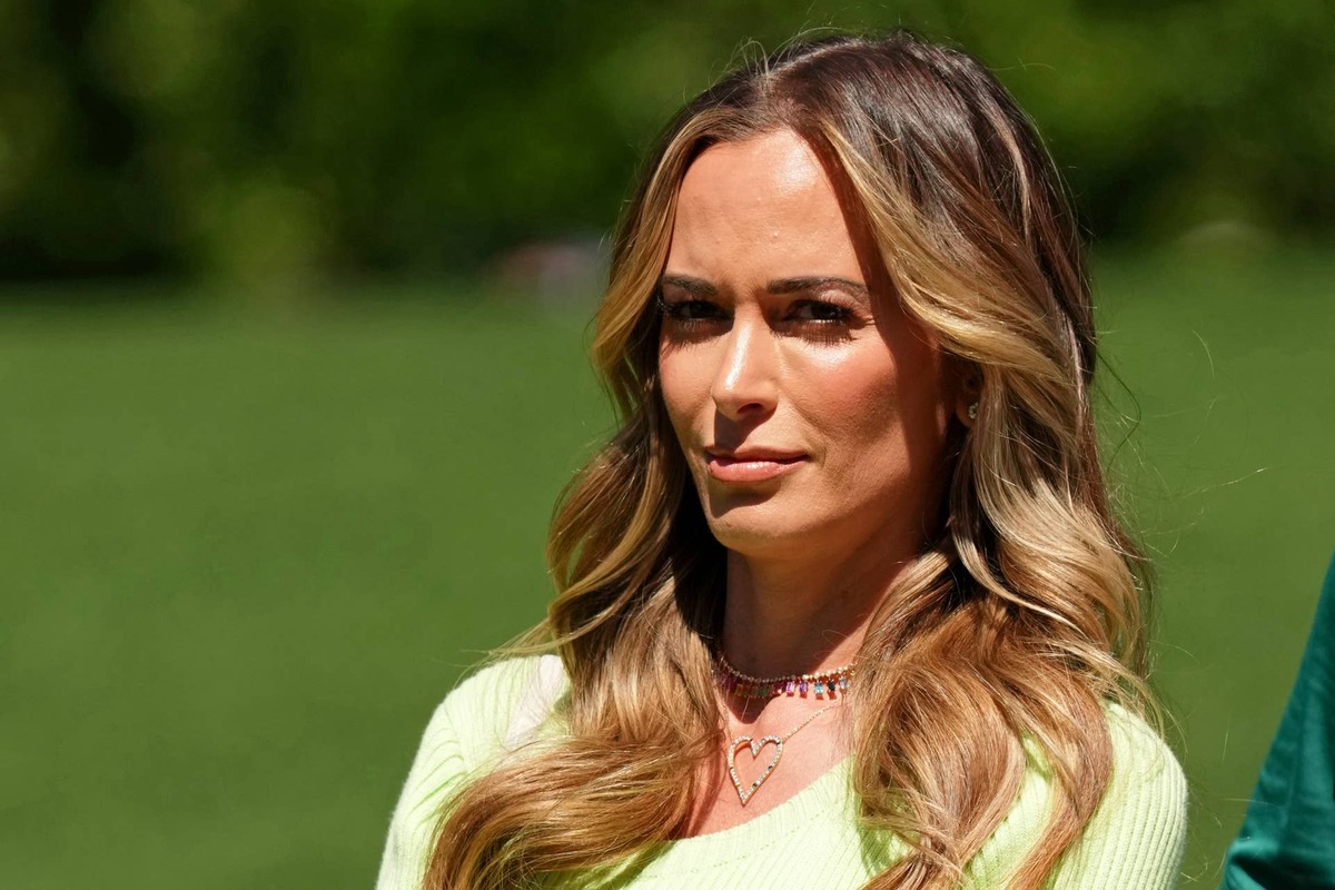  Apr 9, 2023; Augusta, Georgia, USA; Jena Sims, wife of Brooks Koepka (not pictured) watches from the fourth hole during the final round of The Masters golf tournament. Mandatory Credit: Kyle Terada-USA TODAY Network 