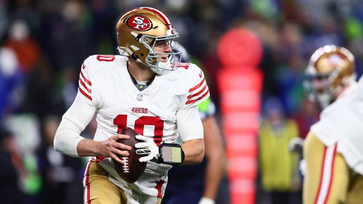  Jan 17, 2026; Seattle, WA, USA; San Francisco 49ers quarterback Mac Jones (10) rolls out against the Seattle Seahawks during the second half in an NFC Divisional Round game at Lumen Field. Mandatory Credit: Kevin Ng-Imagn Images | Kevin Ng-Imagn Images 