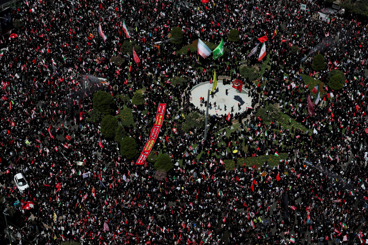 Mourners gather on the day of the burial of Iran's late Supreme Leader Ayatollah Ali Khamenei, who was killed on February 28 in Israeli and U.S. airstrikes, in Mashhad, Iran, July 9, 2026. REUTERS/Mohammed Salem  \