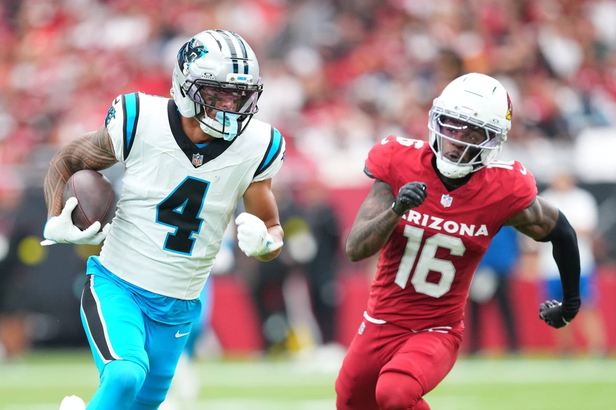  Carolina Panthers wide receiver Tetairoa McMillan runs with the ball against Arizona Cardinals cornerback Max Melton at State Farm Stadium. (Credit: Joe Camporeale-Imagn Images)