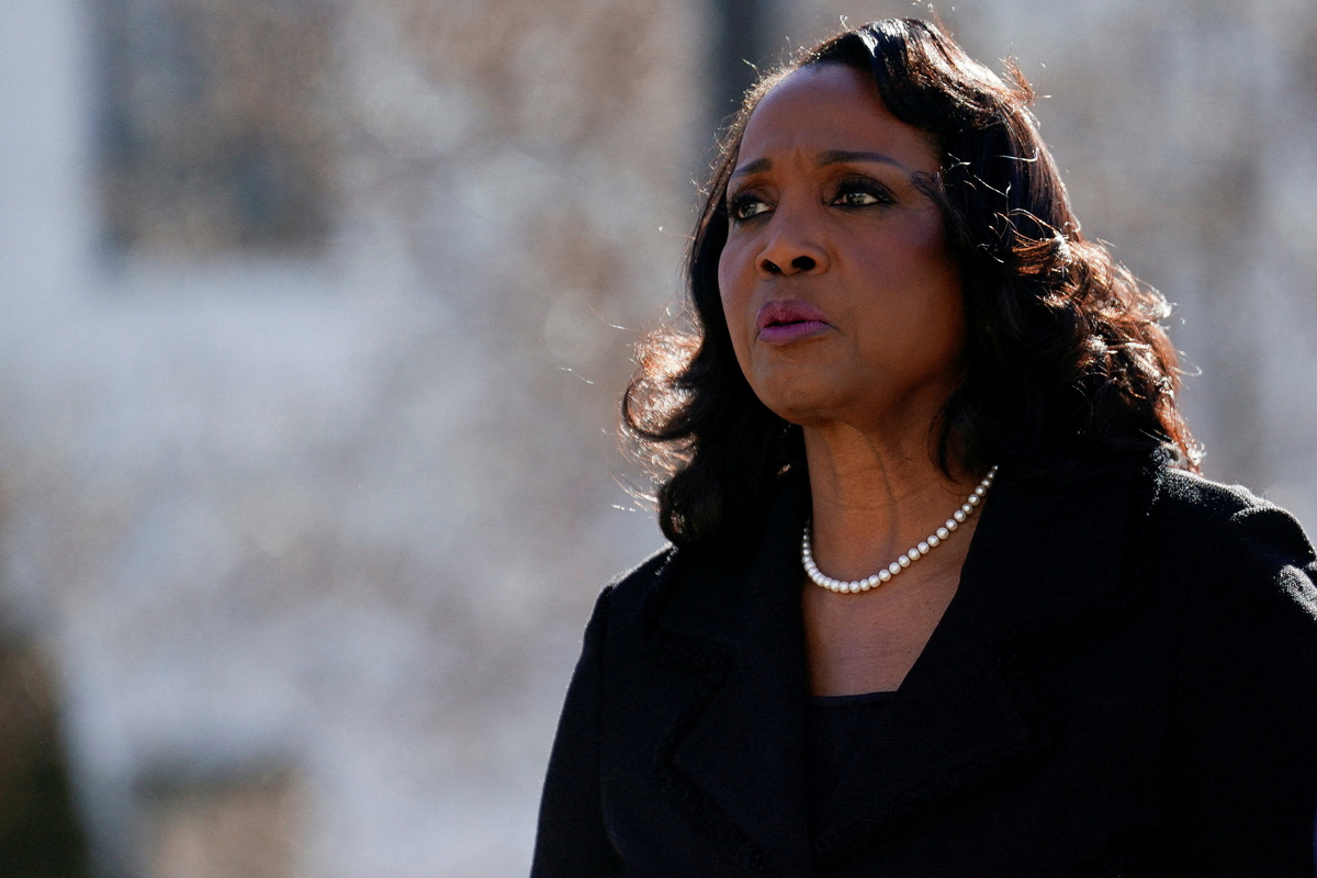 FILE PHOTO: Federal Reserve Governor Lisa Cook walks outside the U.S. Supreme Court, as Supreme Court justices consider U.S. President Donald Trump's effort to fire her, in Washington, D.C., U.S., January 21, 2026. REUTERS/Nathan Howard/File Photo