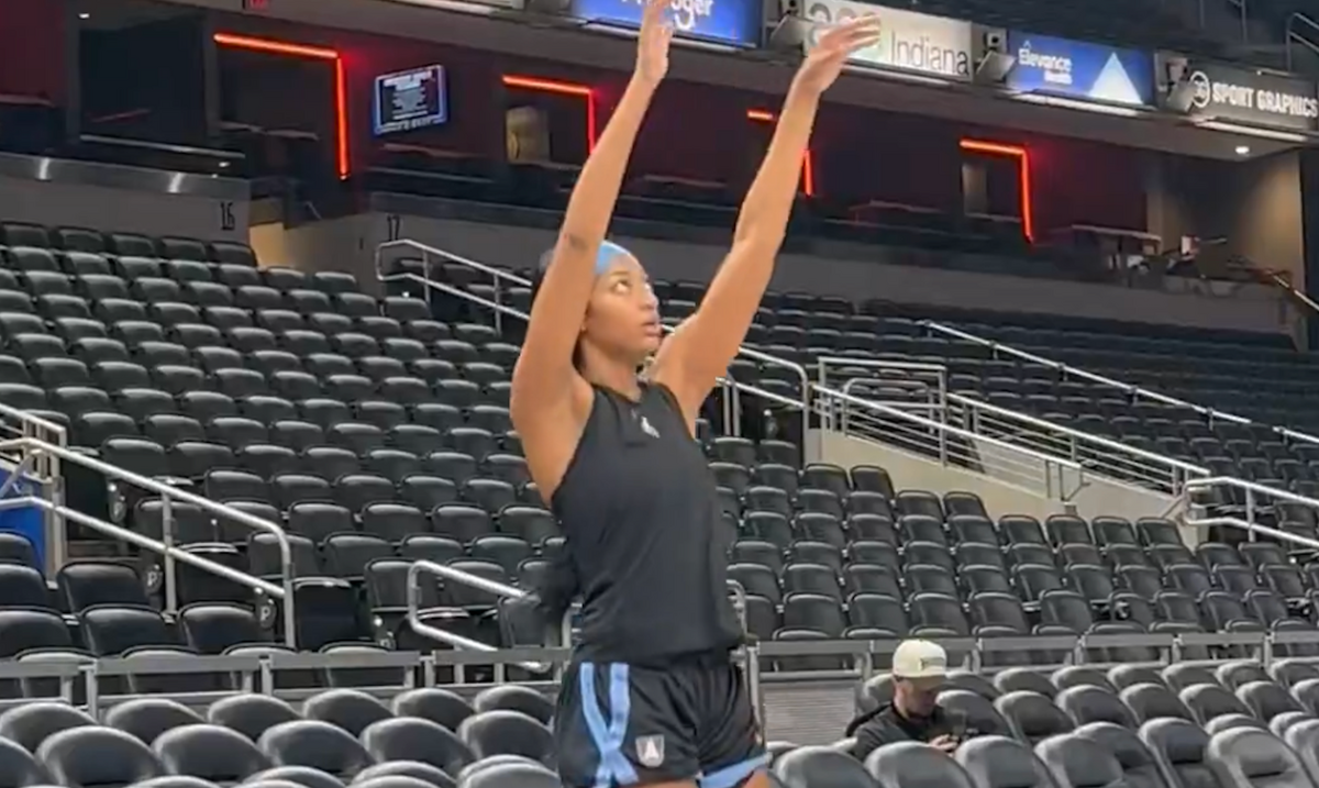 Angel Reese taking warm-up shots.