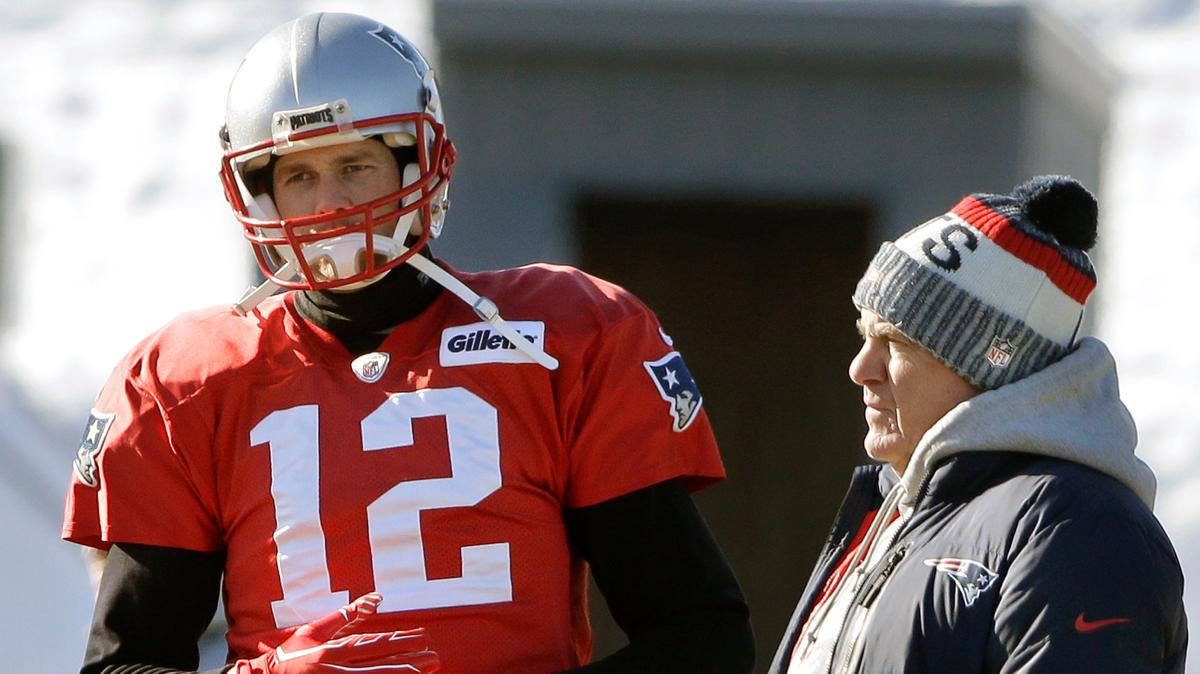 FILE - New England Patriots quarterback Tom Brady, left, stands with head coach Bill Belichick, right, during an NFL football practice, Thursday, Jan. 18, 2018, in Foxborough, Mass. Without Bill Belichick, Tom Brady won his seventh Super Bowl and is on pace to throw a career-high 53 touchdown passes at age 44. Without Brady under center, Belichick is 54-61 over his career, including 8-11 since the future Hall of Fame quarterback left New England for Tampa Bay. (AP Photo/Steven Senne, file)