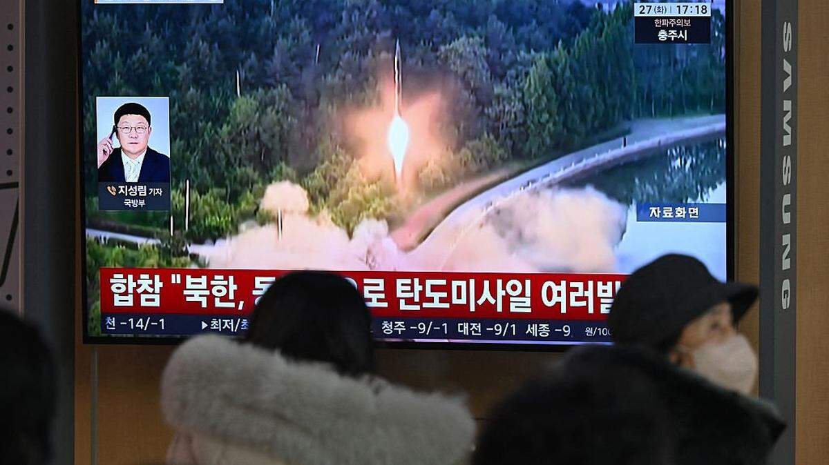 People sit in front of a television screen showing a news broadcast with file footage of a North Korean missile test, at a train station in Seoul, South Korea, on Jan. 27. North Korean leader Kim Jong Un observed a test of a high-thrust, solid-fuel missile engine and declared it a major advancement in the country’s strategic military capability, state media reported Sunday.