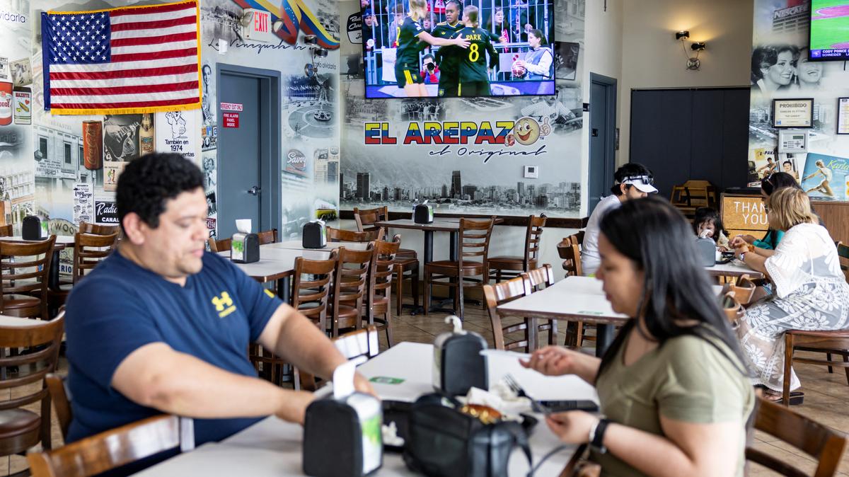 A U.S. flag hangs inside El Arepazo restaurant in Doral, Florida, U.S., April 1, 2026. REUTERS/Eva Marie Uzcategui