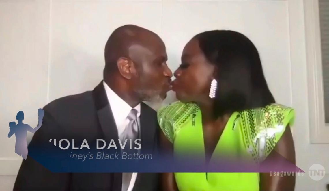 Viola Davis kisses her husband, Julius Tennon, as she accepts the best actress award for “Ma Rainey’s Black Bottom” during Sunday’s 27th annual Screen Actors Guild Awards.