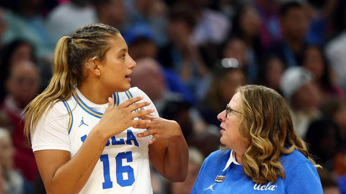 Apr 5, 2026; Phoenix, AZ, USA; UCLA Bruins forward Sienna Betts (16) with head coach Cori Close against the South Carolina Gamecocks during the National Championship game of the women's 2026 NCAA Tournament at Mortgage Matchup Center. Mandatory Credit: Mark J. Rebilas-Imagn Images | Mark J. Rebilas-Imagn Images 