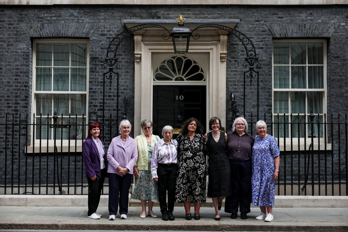 Campaigners pose for a photograph after a meeting with British Prime Minister Keir Starmer to discuss historical forced adoption, outside 10 Downing Street in London, Britain, July 2, 2026. REUTERS/Isabel Infantes/Pool