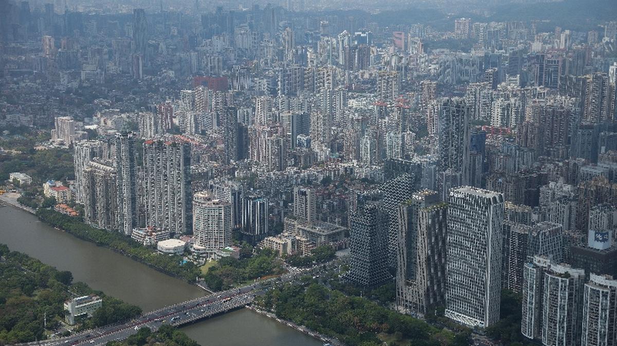 Commercial and residential buildings are pictured in Guangzhou, Guangdong province, China March 17, 2026. REUTERS/Tingshu Wang