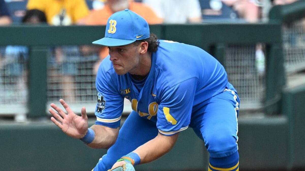  Jun 14, 2025; Omaha, Neb, USA; UCLA Bruins shortstop Roch Cholowsky (1) fields a ground ball against the Murray State Racers during the ninth inning at Charles Schwab Field. Mandatory Credit: Steven Branscombe-Imagn Images | Steven Branscombe-Imagn Images 