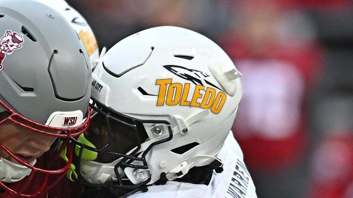  Oct 25, 2025; Pullman, Washington, USA; Washington State Cougars quarterback Zevi Eckhaus (4) is tackled by Toledo Rockets safety Emmanuel McNeil-Warren (7) in the second half at Gesa Field at Martin Stadium. Mandatory Credit: James Snook-Imagn Images | James Snook-Imagn Images 