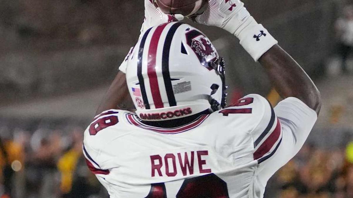  Sep 20, 2025; Columbia, Missouri, USA; South Carolina Gamecocks wide receiver Brian Rowe Jr. (18) catches a pass for a touchdown as Missouri Tigers cornerback Drey Norwood (12) looks on during the first half of the game at Faurot Field at Memorial Stadium. Mandatory Credit: Denny Medley-Imagn Images | Denny Medley-Imagn Images 