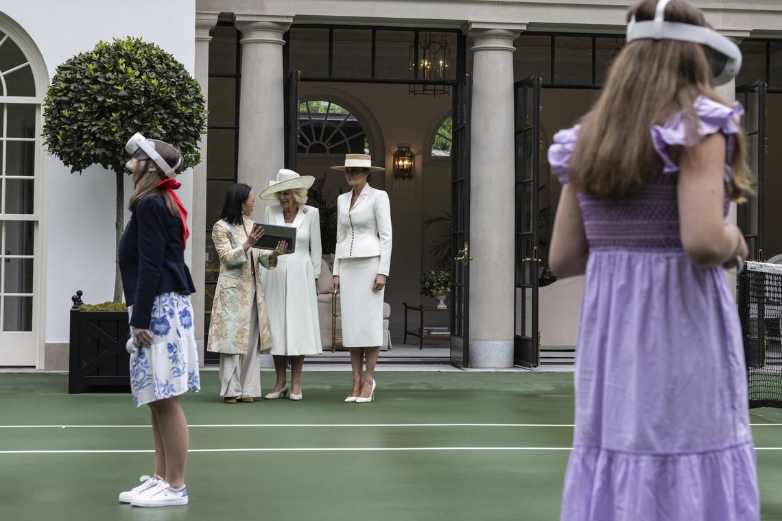 Students use Meta Quest VR headsets as first lady Melania Trump, right, and Queen Camilla arrive for an event on "exploring U.S.-U.K. History through Innovation" at the White House Tennis Pavilion at the White House campus in Washington, on Tuesday, April 28, 2026. (Anna Rose Layden/The New York Times)