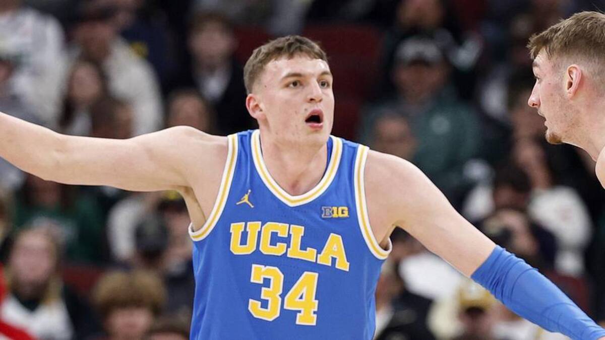  Mar 13, 2026; Chicago, IL, USA; UCLA Bruins forward Tyler Bilodeau (34) defends against Michigan State Spartans center Carson Cooper (15) during the first half at United Center. Mandatory Credit: Kamil Krzaczynski-Imagn Images | Kamil Krzaczynski-Imagn Images 