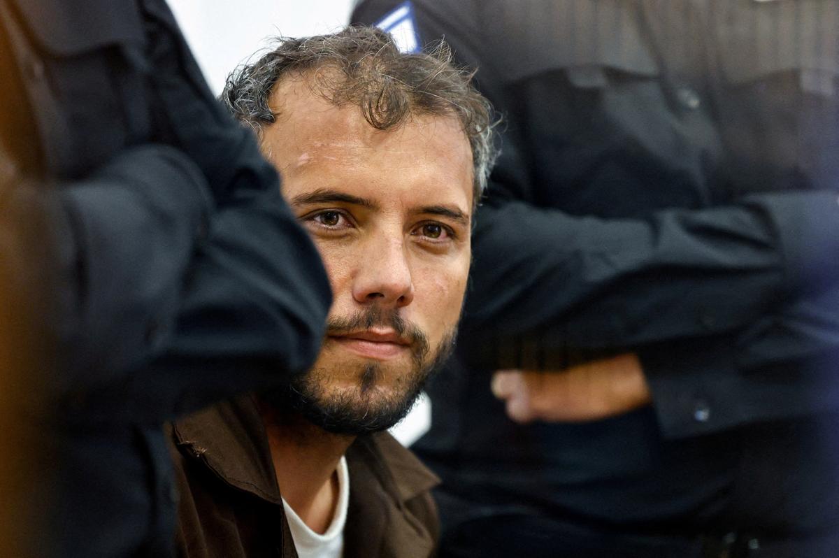 FILE PHOTO: Brazilian Activist Thiago Avila, who was detained aboard the Gaza-bound Global Sumud Flotilla, which was intercepted by Israeli forces in international waters, appears at a court in Beersheba, southern Israel May 6, 2026. REUTERS/Amir Cohen/File Photo