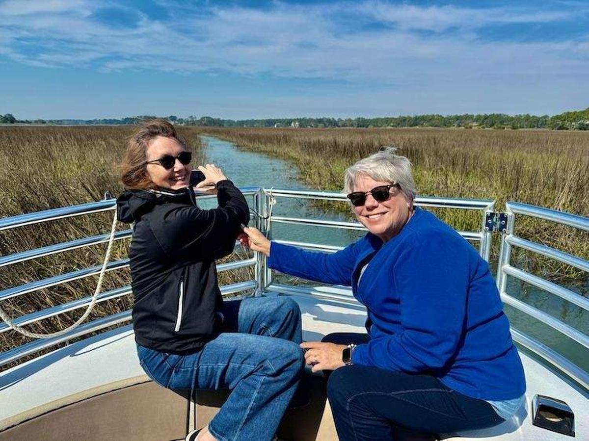  Family and friends enjoy a dolphin eco-tour together; Tamara and Tresa are pictured. Photo credit: Sharon Kurtz 