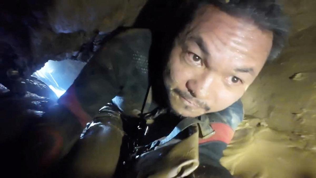 A rescuer makes his way to the people trapped inside a cave in Xaisomboun Province, Laos, in this screengrab obtained from a social media video released on May 28, 2026. Norrased Palasing/via REUTERS