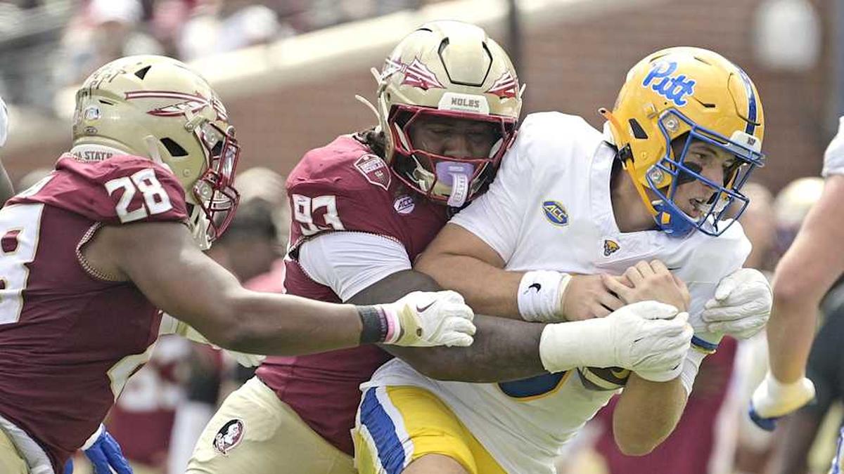  Oct 11, 2025; Tallahassee, Florida, USA; Florida State Seminoles defensive lineman Mandrell Desir (93) sacks Pittsburgh Panthers quarterback Mason Heintschel (6) during the first half at Doak S. Campbell Stadium. Mandatory Credit: Melina Myers-Imagn Images | Melina Myers-Imagn Images 
