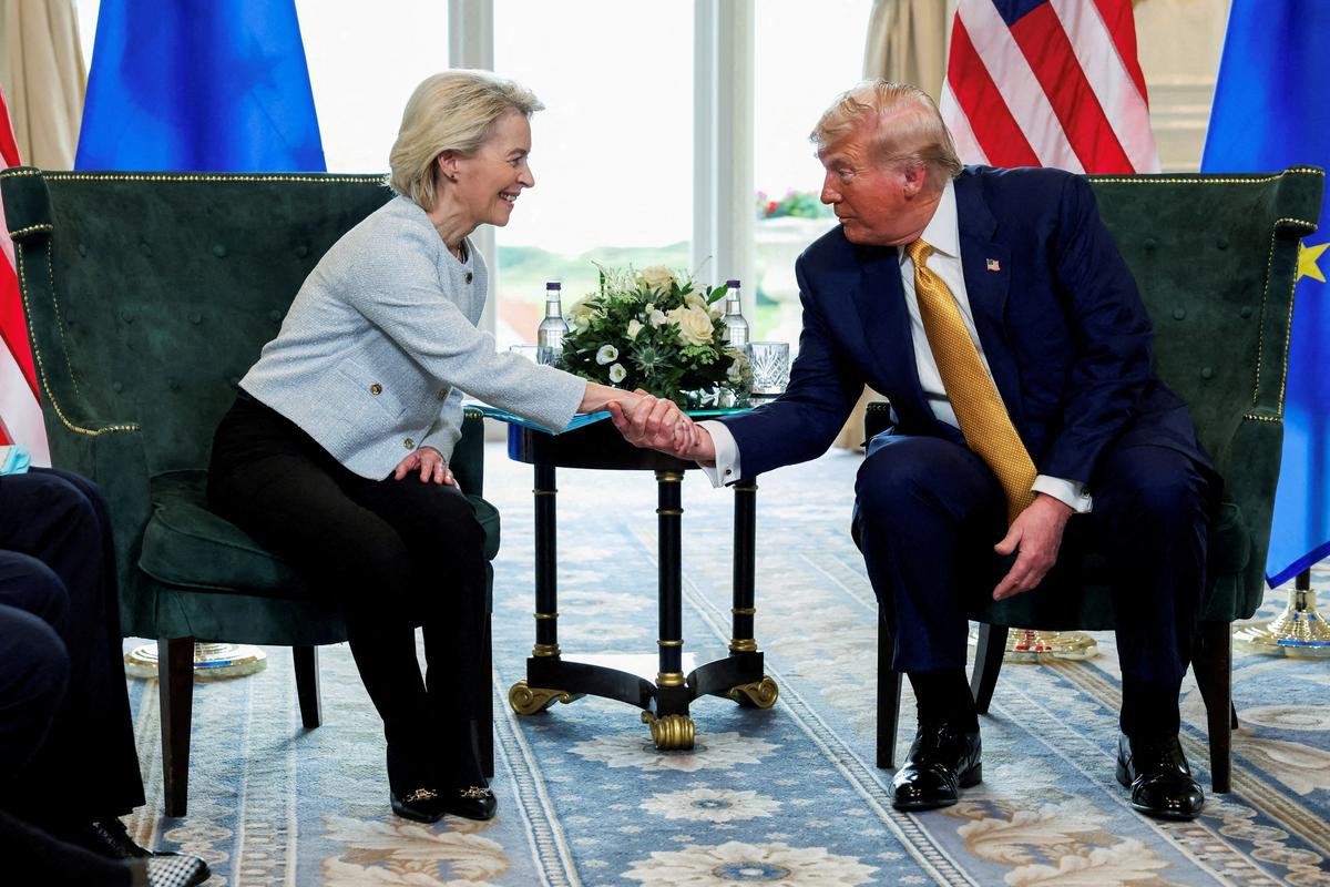 FILE PHOTO: U.S. President Donald Trump shakes hands with European Commission President Ursula von der Leyen, in Turnberry, Scotland, Britain, July 27, 2025. REUTERS/Evelyn Hockstein/File Photo/File Photo