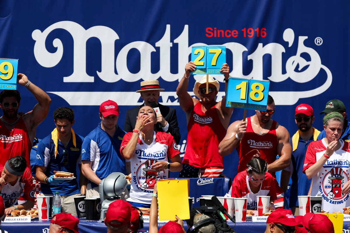 Michelle Lesco from Tucson, Arizona, Miki Sudo from Tampa, Florida, Domenica Dee from Seattle, Washington and Katie Prettyman from Marysville, Washington, participate in the 2026 Nathan's Famous International Hot Dog Eating Contest, at Coney Island, Brooklyn in New York City, U.S., July 4, 2026. REUTERS/Jordan Tovin