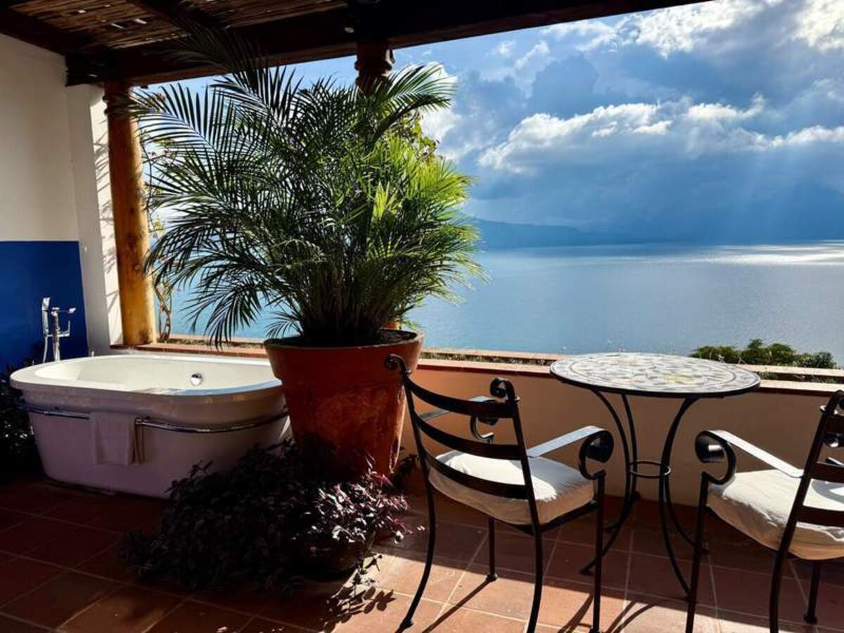  Perfect for romance and slow mornings, this terrace bath offers front-row seats to Lake Atitlán’s dramatic volcano views. Photo credit: Gentry Hale 
