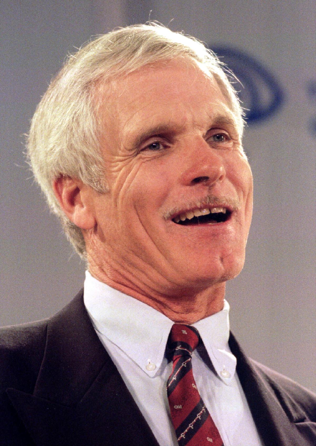 FILE PHOTO: Turner Broadcasting System, Inc. Chairman  Ted Turner speaks at a press conference in New York September 22 where it was announced that his company would merge with Time Warner Inc., forming a global media organization. Turner will be vice-chairman of the company and join the Time Warner board/File Photo