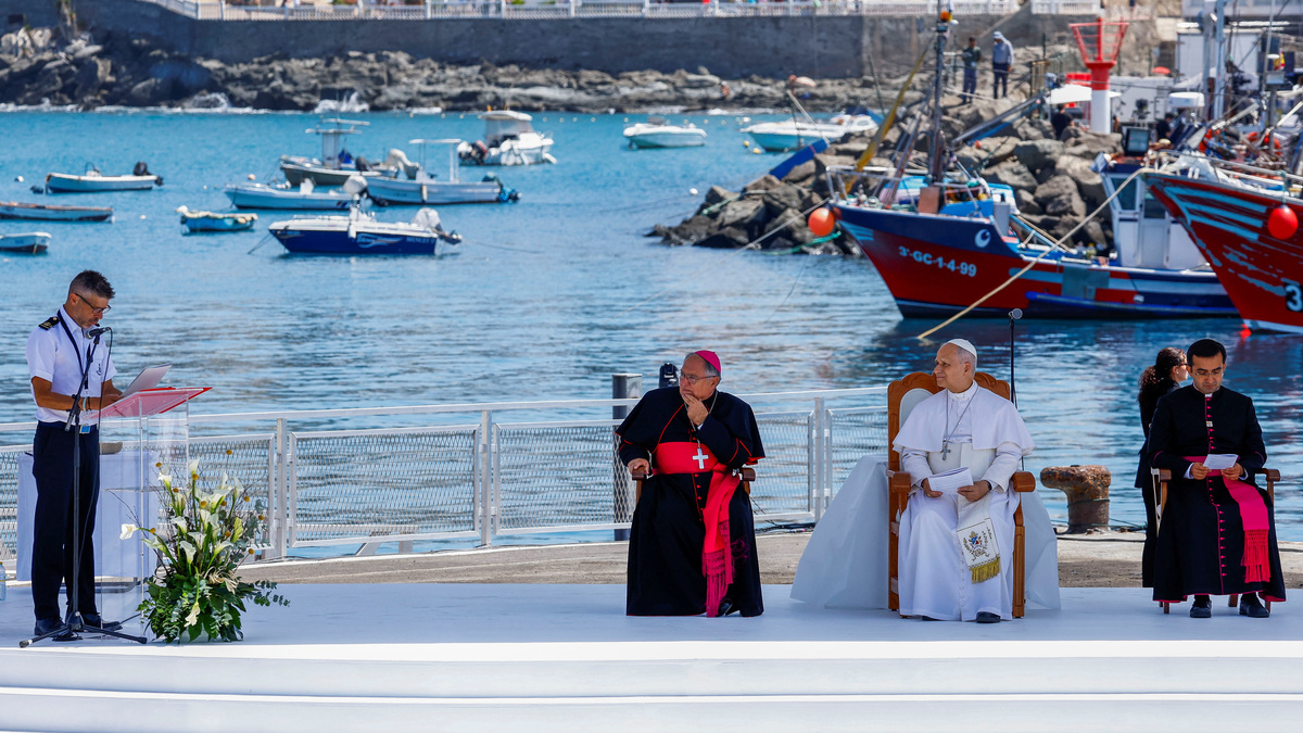 Pope Leo XIV listens as Tito Villarmea Captain of Guardamar Urania rescue boat speaks during a meeting with organizations working with migrants at the Port of Arguineguin, during his apostolic journey on the island of Gran Canaria, Spain June 11, 2026. REUTERS/Borja Suarez