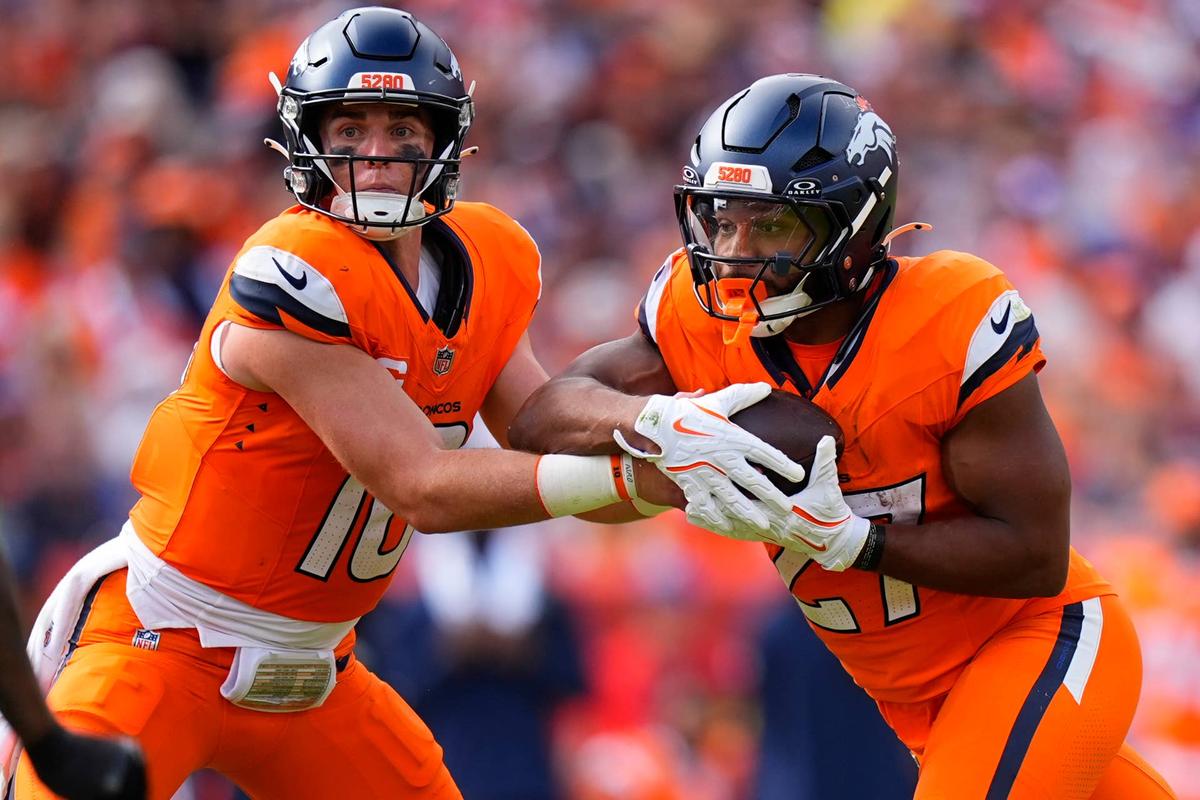  Sep 7, 2025; Denver, Colorado, USA; Denver Broncos running back J.K. Dobbins (27) receives a hand off from quarterback Bo Nix (10) during the second half at Empower Field at Mile High. Mandatory Credit: Ron Chenoy-Imagn Images 