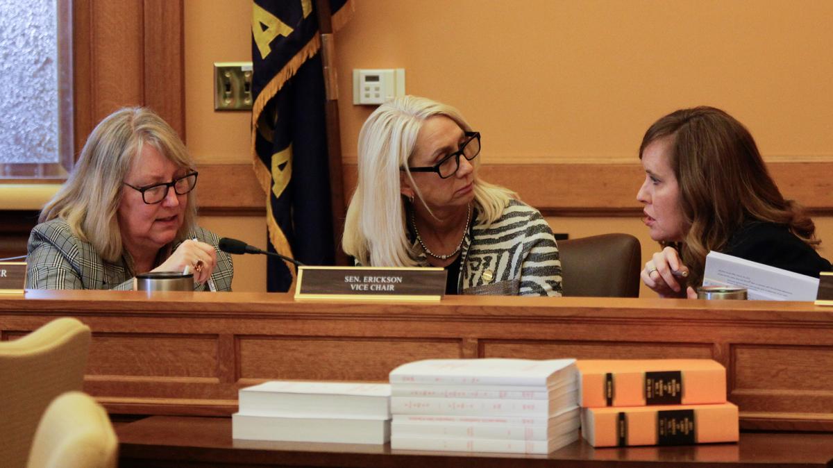 Kansas state Sens. Molly Baumgardner, from left, R-Louisburg; Renee Erickson, R-Wichita; and Dinah Sykes, D-Lenexa, confer during a break in negotiations with House members over education policy, at the Statehouse in Topeka March 31. Republican lawmakers hoped to tie extra money for public schools to policy changes.
