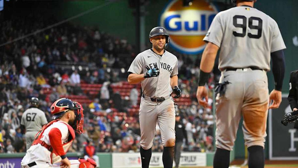 New York Yankees designated hitter Giancarlo Stanton (27) reacts as he scores a run off a three run home run against the Boston Red Sox by third baseman Amed Rosario (14) (not pictured) at Fenway Park. | Eric Canha-Imagn Images 