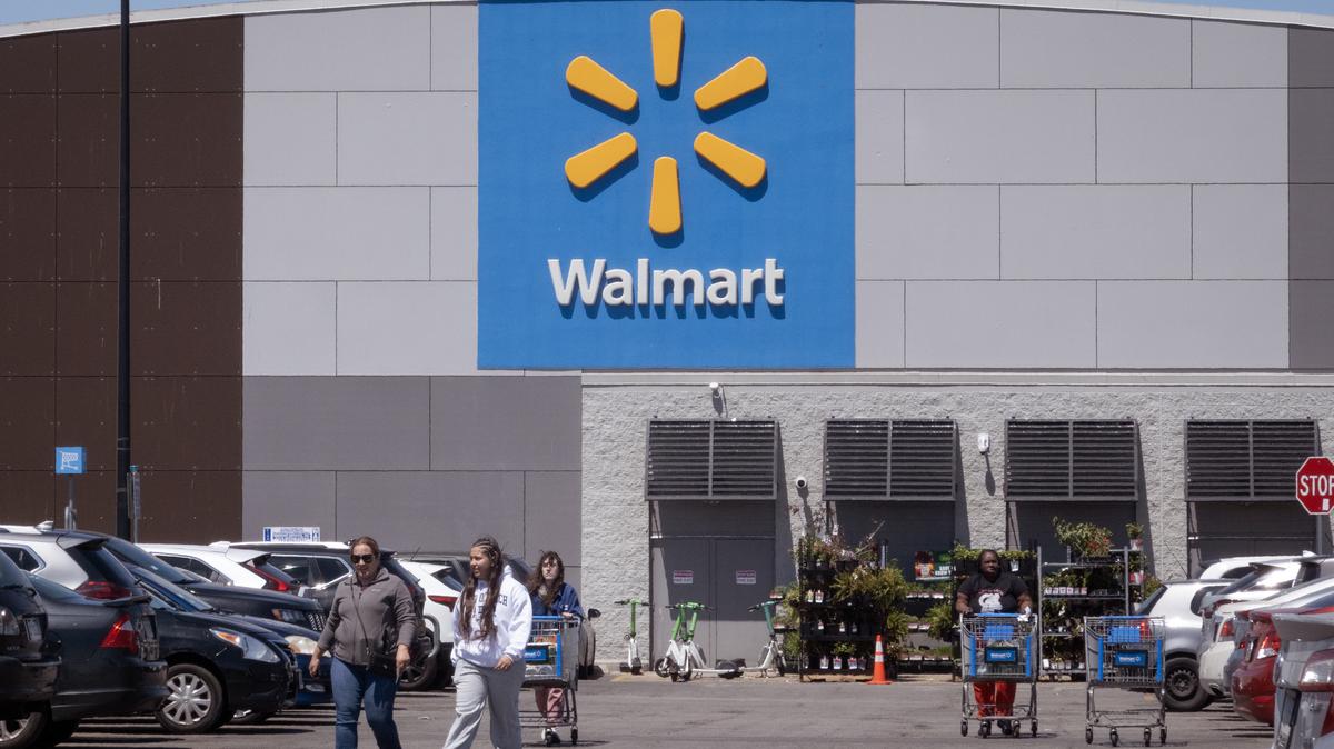 Walmart To Layoff And Relocate 1,000 Positions. Customers shop at a Walmart store on May 13, 2026 in Chicago, Illinois. 
