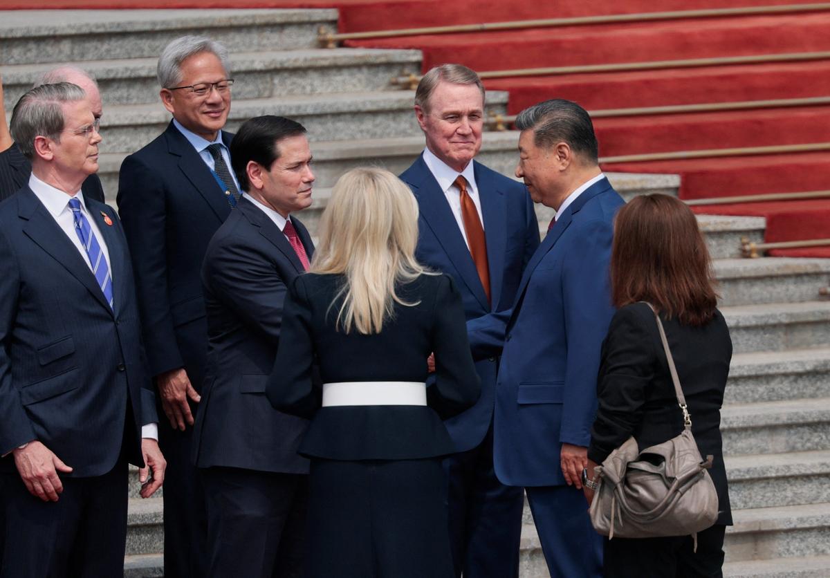 Chinese President Xi Jinping shakes hands with U.S. Secretary of State Marco Rubio while he stands alongside U.S. Ambassador to China David Perdue, U.S. Secretary of the Treasury Scott Bessent and Jensen Huang, Founder, President and CEO of Nvidia during a welcoming ceremony for U.S. President Donald Trump (not pictured) at the Great Hall of the People in Beijing, China, May 14, 2026. REUTERS/Evan Vucci