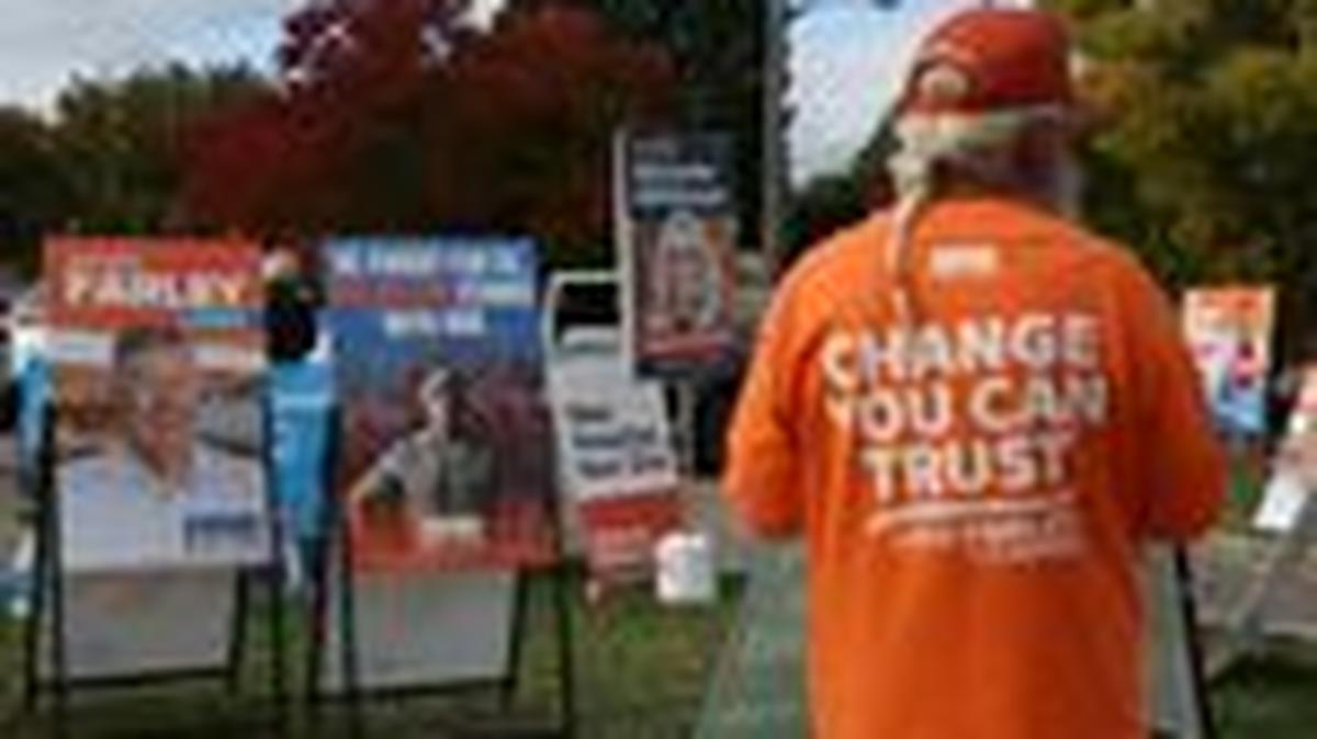 Campaign signs depicting One Nation candidate David Farley and former Australia soldier Ben Roberts-Smith are displayed outside a pre-polling centre ahead of the Farrer by-election in Albury, Australia, May 6, 2026. REUTERS/Hollie Adams