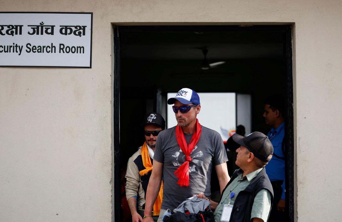 British climber Kenton Cool, 49, walks out from the airport, as he returns after completing his 17th ascent of Mount Everest, which is the most by any foreign climber, in Kathmandu, Nepal May 19, 2023. REUTERS/Navesh Chitrakar