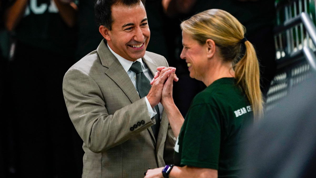 Collier County Public Schools Chief Communication Officer Chad Oliver high fives Principal Margaux Horne during a ribbon cutting ceremony at Bear Creek Elementary School in Naples, Fla., on Friday, Aug. 1, 2025.