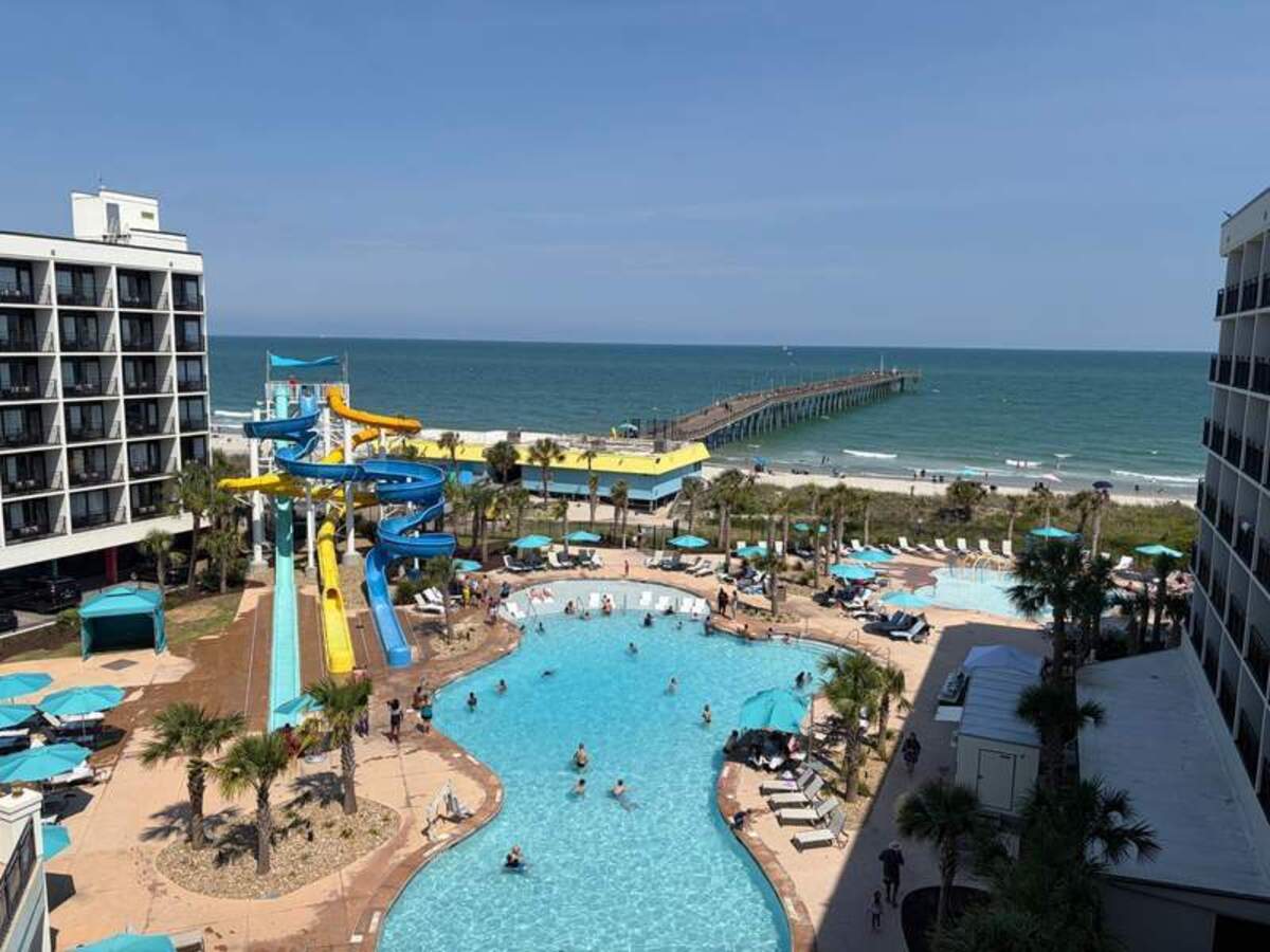  My kids could spend all day here! The massive resort pool, lazy river, and winding waterslides at Ellie Beach Resort are just a few reasons why Myrtle Beach is a top-tier choice for a memorable multi-generational getaway. Photo credit: Emily Caldwell 