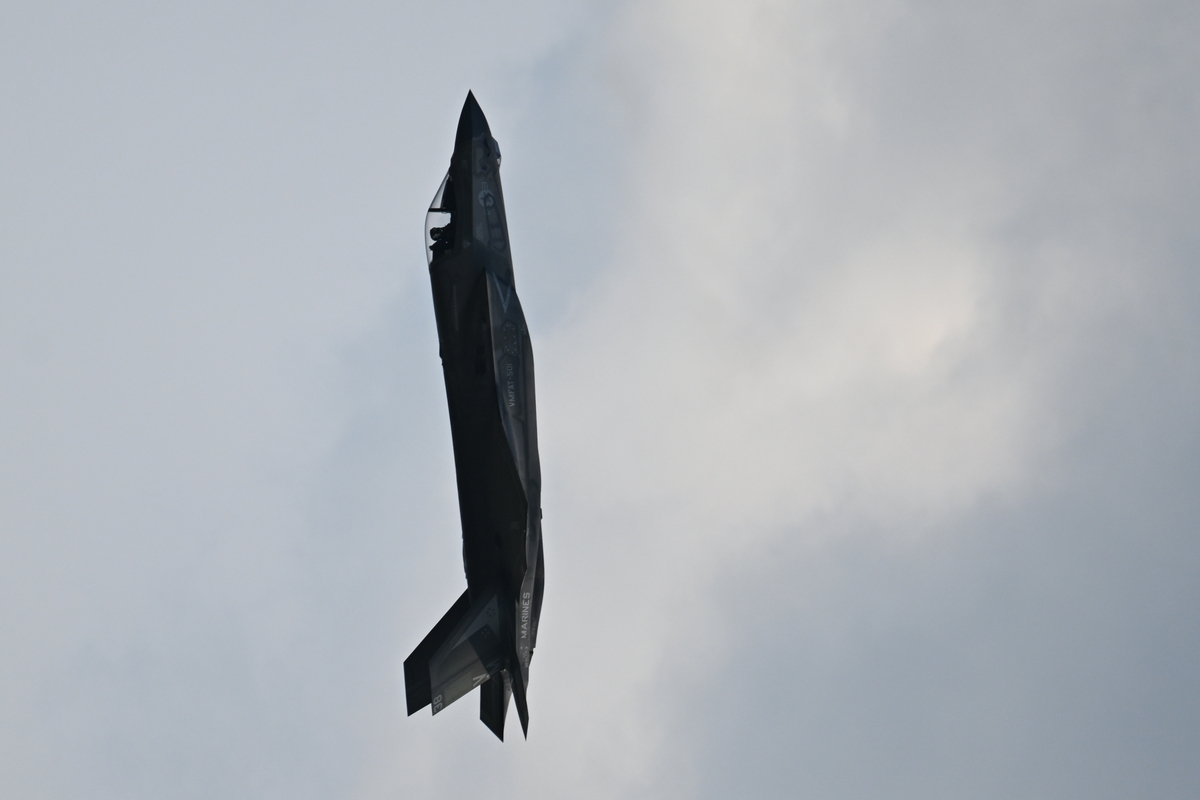 A F-35B flies inverted over the National Mall in Washington during the America 250 celebration on July 4, 2026. As an air show continued over the National Mall, the Washington Monument Grounds remained empty, with crowds for the "Salute to America" just starting to trickle in after the event was delayed due to heat. (Kenny Holston/The New York Times)