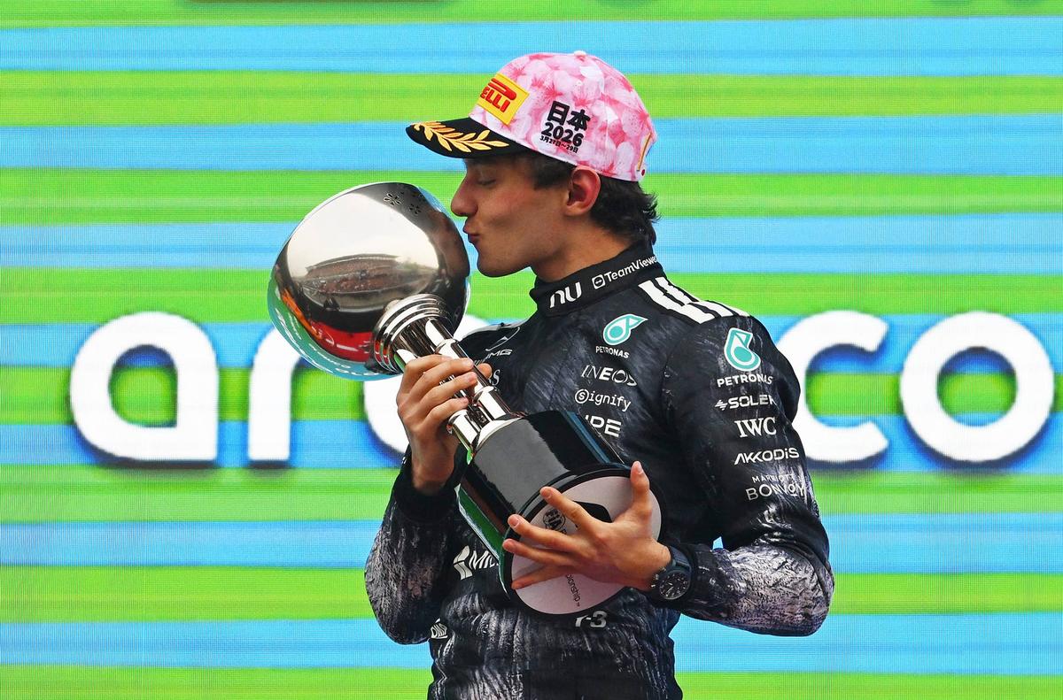  Kimi Antonelli kisses his race-winning trophy at the 2026 F1 Japanese Grand Prix. Photo by Rudy Carezzevoli/Getty Images